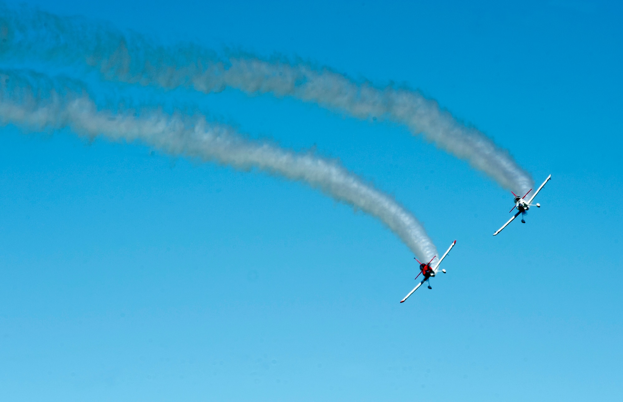 RedLine AirShows performers fly during the AirPower over Hampton Roads Open House at Langley Air Force Base, Va., April 24, 2016. RedLine Airshows is a two-ship team that performs opposing, inverted and formation maneuvers. (U.S. Air Force photo by Senior Airman R. Alex Durbin)
