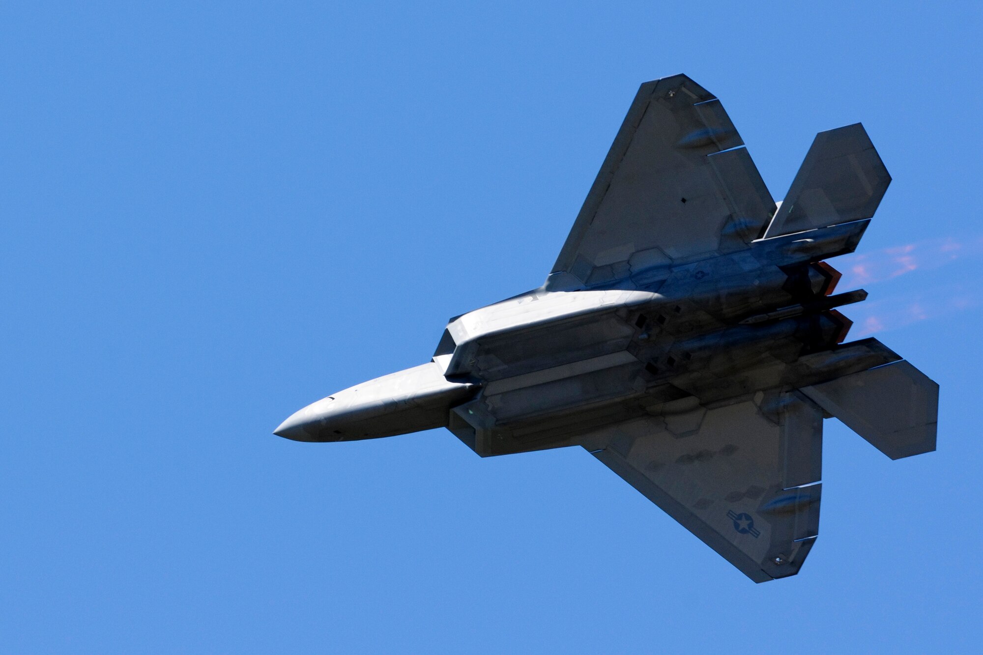 A U.S. Air Force F-22 Raptor soars above the AirPower over Hampton Roads Open House crowd at Langley Air Force Base, Va., April 24, 2016. In its demonstration, the aircraft showed stealth, supercruise, maneuverability, and integrated avionic warfighting capabilities. (U.S. Air Force photo by Staff Sgt. Natasha Stannard)