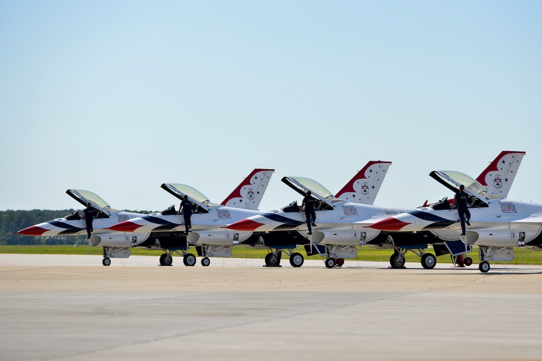 U.S. Air Force Thunderbirds aerial demonstration team crew chiefs check in with pilots before their flight during the AirPower over Hampton Roads Open House at Langley Air Force Base, Va., April 24, 2016. The Thunderbirds fly the  F-16 Fighting Falcon, the Air Force’s first multi-role fighter aircraft. (U.S. Air Force photo by Staff Sgt. Natasha Stannard)