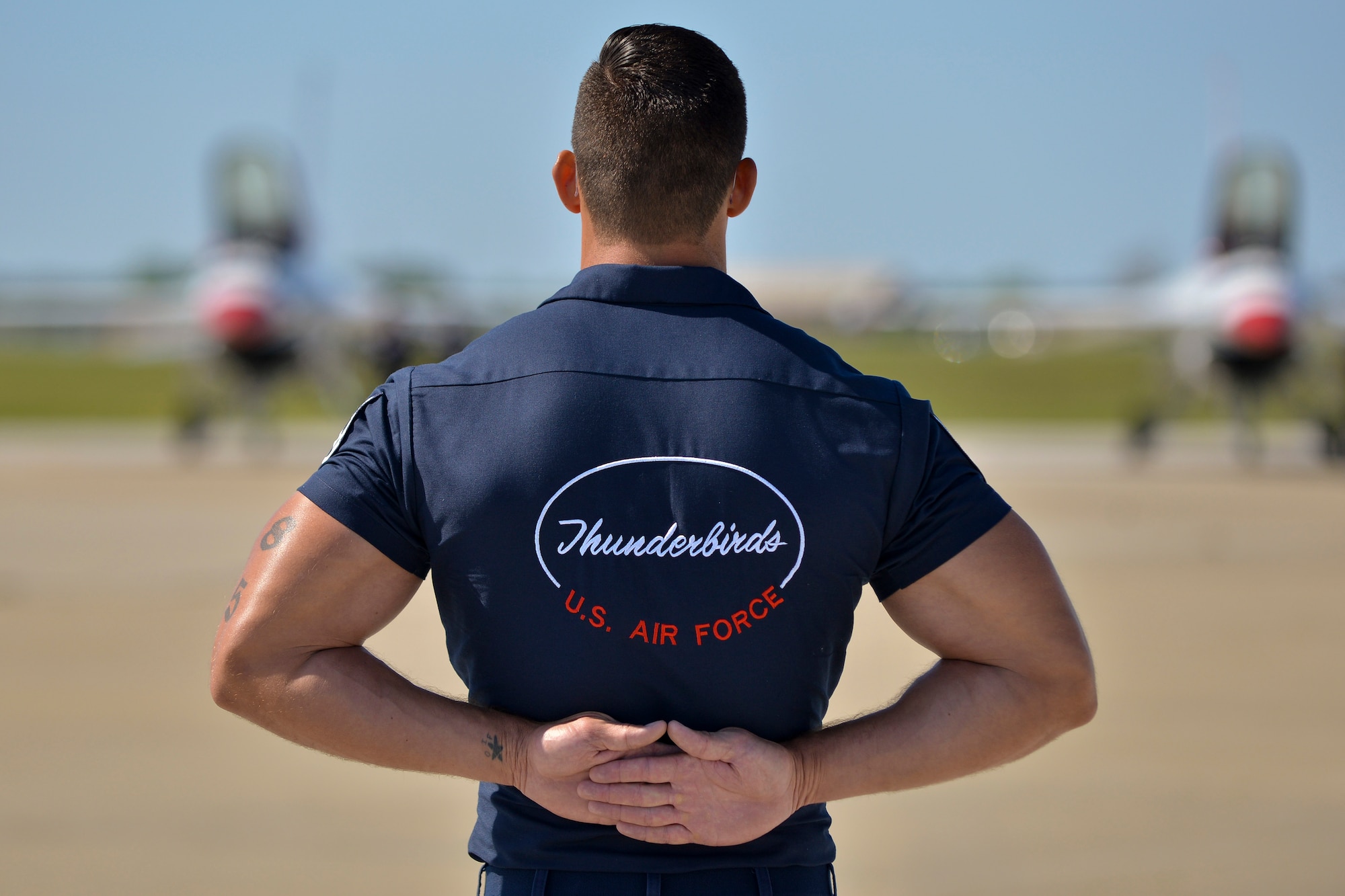 A U.S. Air Force Thunderbirds aerial demonstration team member stands ready to conduct aircraft checks before the team’s performance at Langley Air Force Base, Va., April 24, 2016. The Thunderbirds performed at Langley as part of the base’s open house titled Air Power Over Hampton Roads. (U.S. Air Force photo by Staff Sgt. Natasha Stannard)