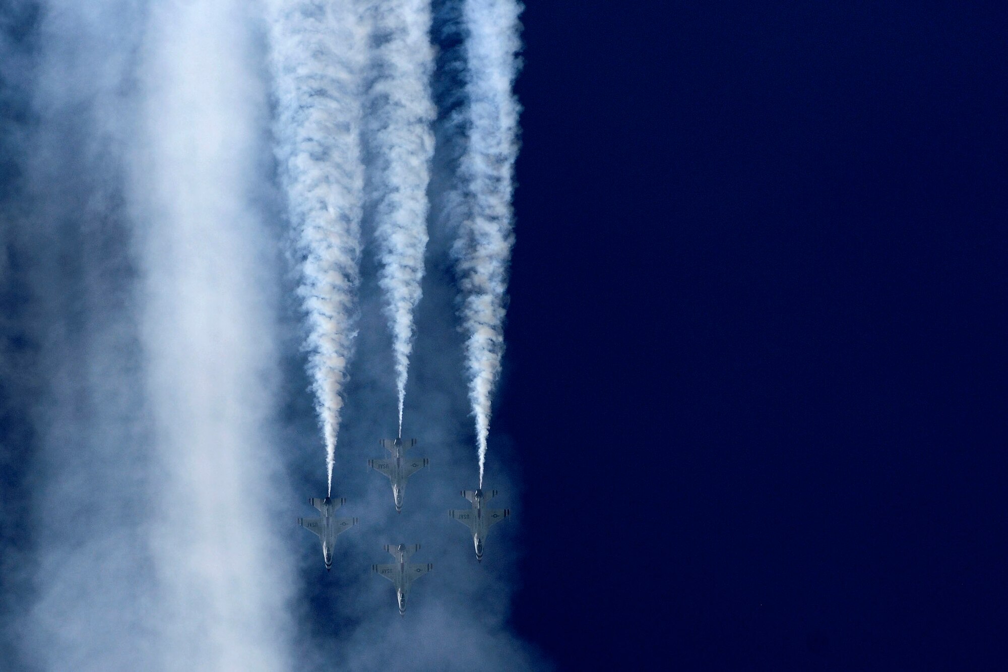 The U.S. Air Force Thunderbirds aerial demonstration team performs aerial maneuvers during the AirPower over Hampton Roads Open House at Langley Air Force Base, Va., April 24, 2016. Scheduled to perform three times throughout the open house, the team only got to perform once due to weather conditions. (U.S. Air Force photo by Staff Sgt. Natasha Stannard)