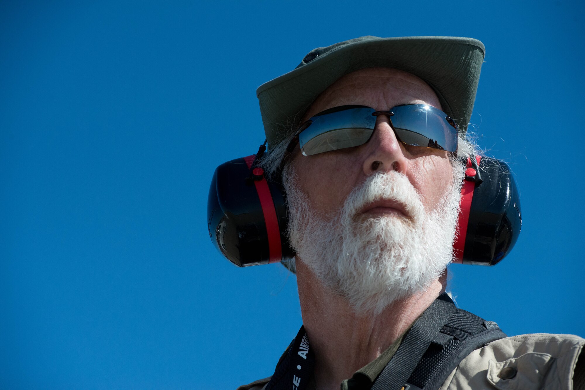 A photographer looks for his next subject during the AirPower over Hampton Roads Open House at Langley Air Force Base, Va., April 24, 2016. The first open house at Langley Air Force Base was held in 1919 and was called an aerial circus. (U.S. Air Force photo by Staff Sgt. J.D. Strong II)
