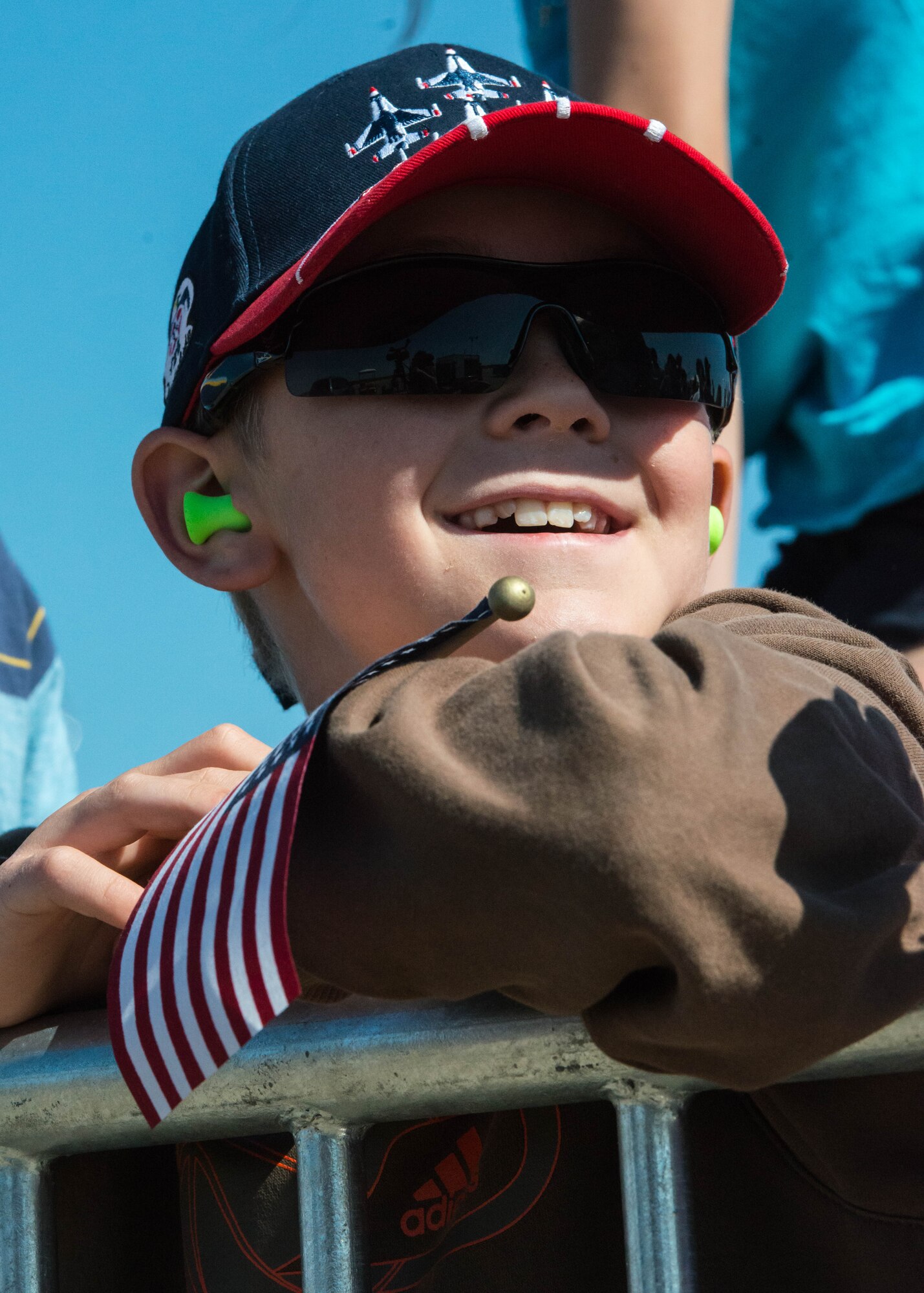 A young spectator watches an aerial demonstration by the U.S. Air Force Thunderbirds during the AirPower over Hampton Roads Open House at Langley Air Force Base, Va., April 24, 2016. The Thunderbirds objectives are to support Air Force recruiting and retention programs and to reinforce public confidence in the Air Force and to demonstrate to the public the professional competence of Air Force members.
 (U.S. Air Force photo by Staff Sgt. J.D. Strong II)
