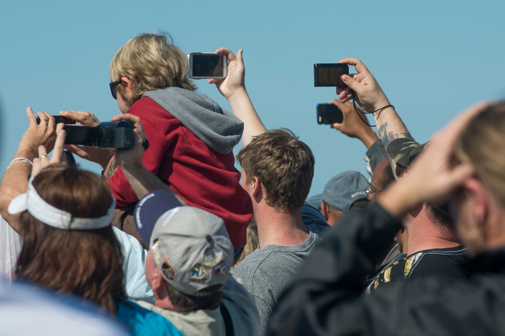 A crowd takes pictures of the performers during the AirPower over Hampton Roads Open House at Langley Air Force Base, Va., April 24, 2016. The open house aims to educate the public on past and present Air Force aerial capabilities, increase recruiting and show appreciation to the local community.
(U.S. Air Force photo by Senior Airman Kayla Newman)

