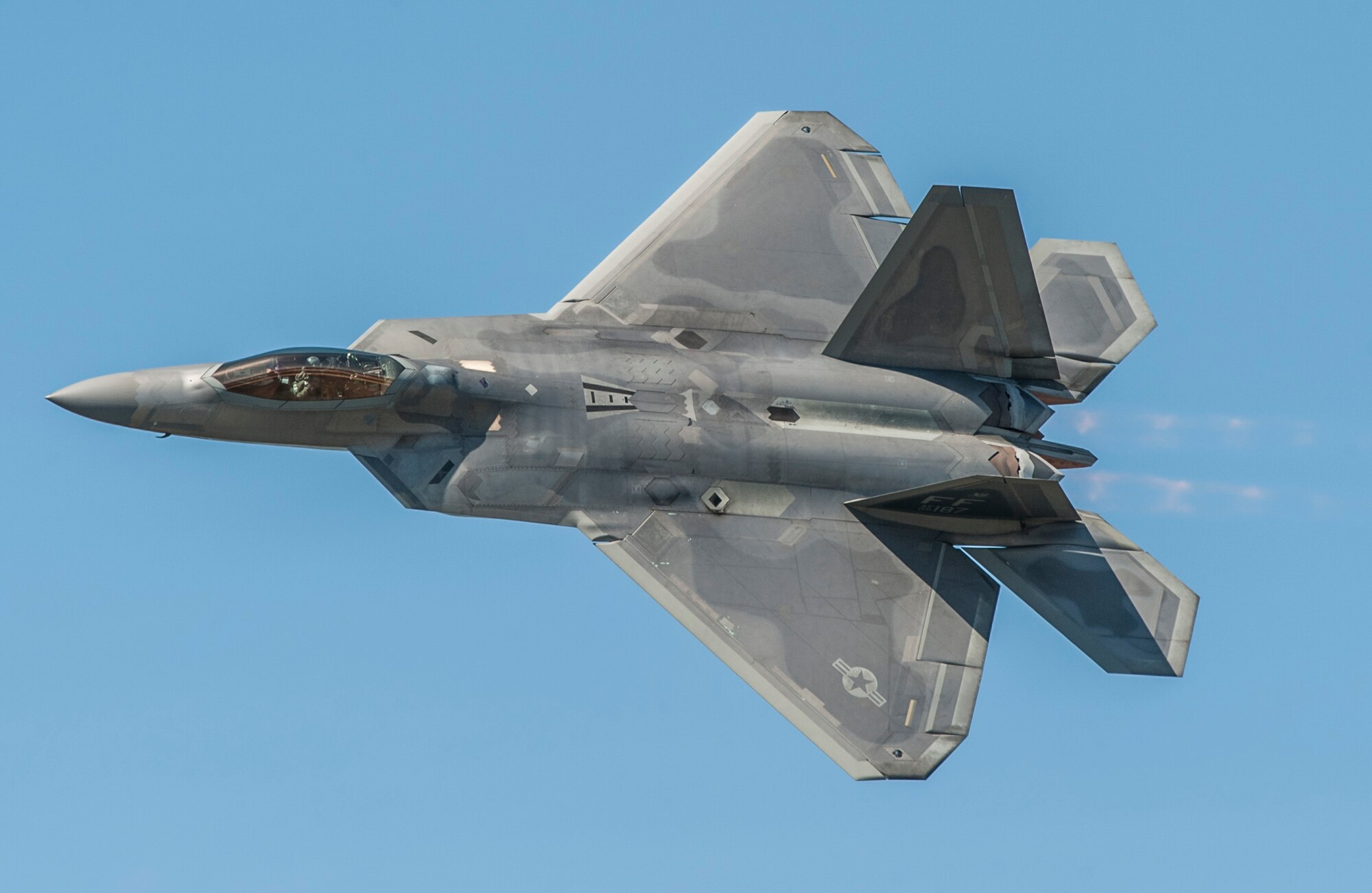 The Air Combat Command F-22 Raptor Demonstration Team aircraft flies during the AirPower over Hampton Roads Open House at Langley Air Force Base, Va., April 24, 2016. The team also works with the Air Force Heritage flight exhibiting the professional qualities the Air Force develops in the people who fly, maintain and support these aircraft. (U.S. Air Force photo by Senior Airman Kayla Newman)
