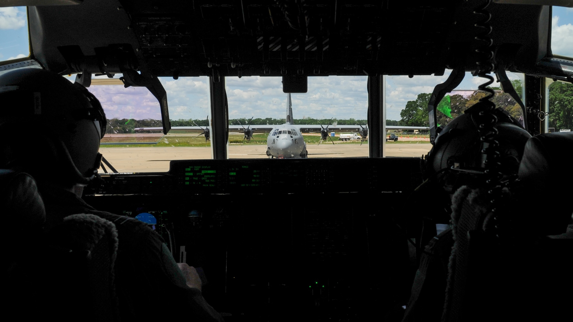 Royal Australian Air Force C-130J pilots prepare to takeoff after uploading a Humvee April 22, 2016, at an intermediate staging base in Alexandria, La. Several C-130s from four different nations converged at Little Rock Air Force Base, Ark., for Green Flag 16-06. (U.S. Air Force photo/ Senior Airman Harry Brexel)  