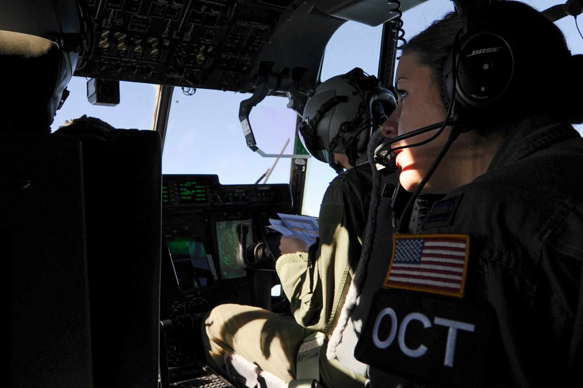 U.S. Air Force Capt. Kelsie Winklmann, a 34th Combat Training Squadron C-130H navigator instructor, acts as an Observer Coach Trainer for Royal Australian Air Force C-130J pilots during Green Flag 16-06 April 22, 2016, over Fort Polk, La. Rotational Green Flag exercises provide realistic, tactical-level joint combat employment training which is tailored to the specific needs of mobility Air Forces. (U.S. Air Force photo/Senior Airman Harry Brexel)  