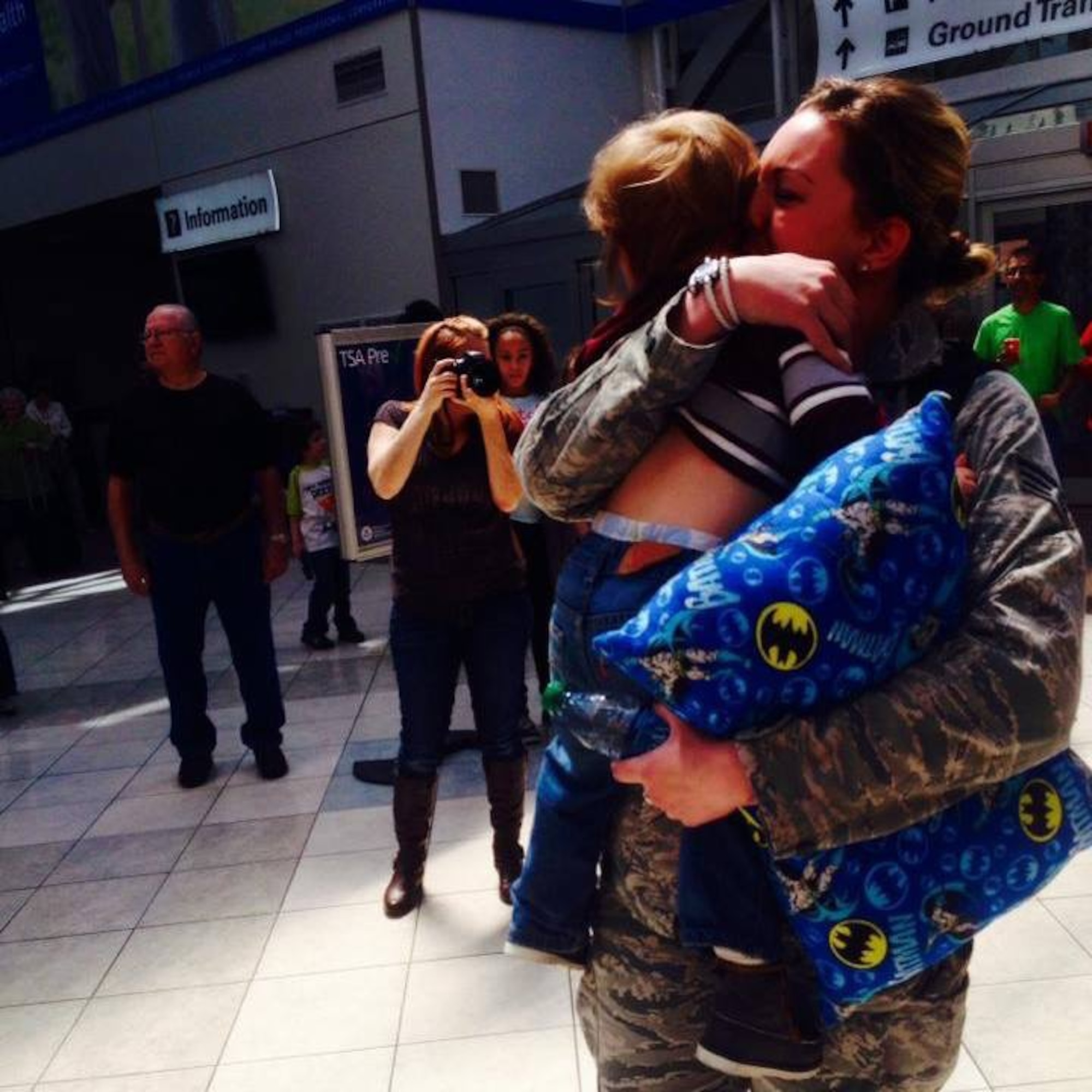 Senior Airman Kayla Canavan, pediatric medical technician, 88 MDOS/SGOC, returned from deployment in February, pictured here with her son. (Contributed photo)