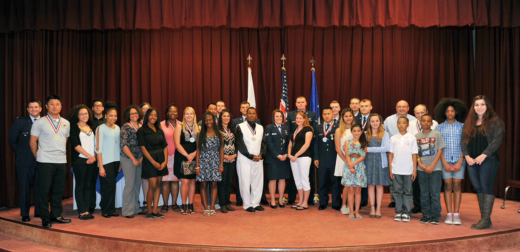The award winners from the Annual Volunteer Recognition Ceremony were recognized at the Officer's Club, April 22, 2016, at Kadena Air Base, Japan. Over the past year, volunteers have offered more than 682,000 hours of their own time to help various organizations and causes throughout the base and local community. (U.S. Air Force photo by Naoto Anazawa)

