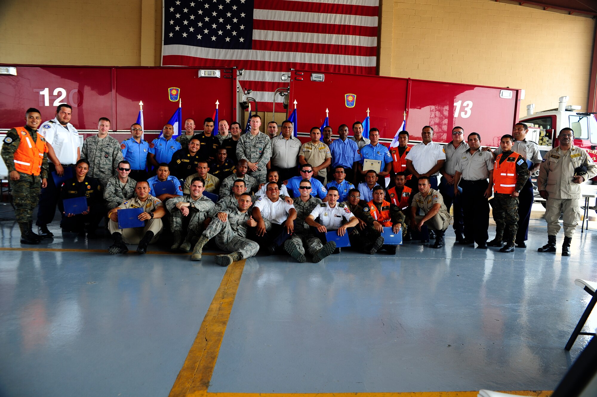 Members of the U.S. and Central American firefighting teams gather for a group photo during the CENTAM SMOKE (Sharing Mutual Operational Knowledge and Experience), a biannual event hosted by Joint Task Force-Bravo at Soto Cano Air Base, Honduras, April 22, 2016. Joint Task Force-Bravo has trained 866 firefighters from Guatemala, El Salvador, Honduras, Nicaragua, Costa Rica, Panama, and Belize since 2005, providing an opportunity for U.S. and Central American firefighters to work as one, building collaborative relationships as partner nations and allowing those involved to take valuable lessons back to their countries. (U.S. Army photo by Martin Chahin/Released)