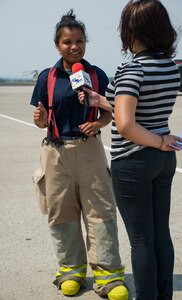 Nicaraguan firefighter Sofia Medina is interviewed by Erika Rivera, a journalist from Marte TV in Comayagua, Honduras, during a CENTAM SMOKE (Sharing Mutual Operational Knowledge and Experience) exercise at Soto Cano Air Base, Honduras, April 20, 2016. This iteration of CENTAM SMOKE included 34 firefighters participating in strenuous and challenging firefighting activities next to their U.S. counterparts. (U.S. Air Force Photo by Capt. David Liapis/Released)