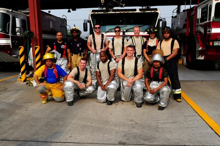 Members of the U.S. and Central American firefighting teams gather for a group photo after completing a relay race that tested their endurance and skills using firefighting equipment during CENTAM SMOKE (Sharing Mutual Operational Knowledge and Experience), a biannual event hosted by Joint Task Force-Bravo at Soto Cano Air Base, Honduras, April 19, 2016. During this iteration, the combined Central American team, comprised of fire crew member from Guatemala, El Salvador, Honduras, Nicaragua, Costa Rica, Panama and Belize, beat the U.S. team by a difference of four seconds. (U.S. Army photo by Martin Chahin/Released)