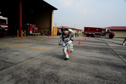 U.S. Air Force Staff Sgt Christopher Gonzales, 612th Air Base Squadron firefighter crew chief, demonstrates a proper hose carry to 34 firefighters from seven Central American countries during a CENTAM SMOKE (Sharing Mutual Operational Knowledge and Experience) exercise at Soto Cano Air Base, Honduras, April 19, 2016. The purpose of this exercise is to promote cross-functional development between all participating countries, to aid and improve humanitarian and civic assistance operations, promote regional cooperation that will improve collective capabilities, and strengthen partnerships. (U.S. Army photo by Martin Chahin/Released)