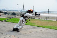 U.S. Air Force Senior Airman Logan Brouse, 612th Air Base Squadron fire protection specialist, demonstrates the use of a fire hose while training firefighters from Guatemala, El Salvador, Honduras, Nicaragua, Costa Rica, Panama and Belize during CENTAM SMOKE (Sharing Mutual Operational Knowledge and Experience), a biannual event hosted by Joint Task Force-Bravo at Soto Cano Air Base, Honduras, April 19, 2016. This iteration of CENTAM SMOKE included 34 firefighters participating in strenuous and challenging firefighting activities next to their U.S. counterparts. (U.S. Army photo by Martin Chahin/Released)