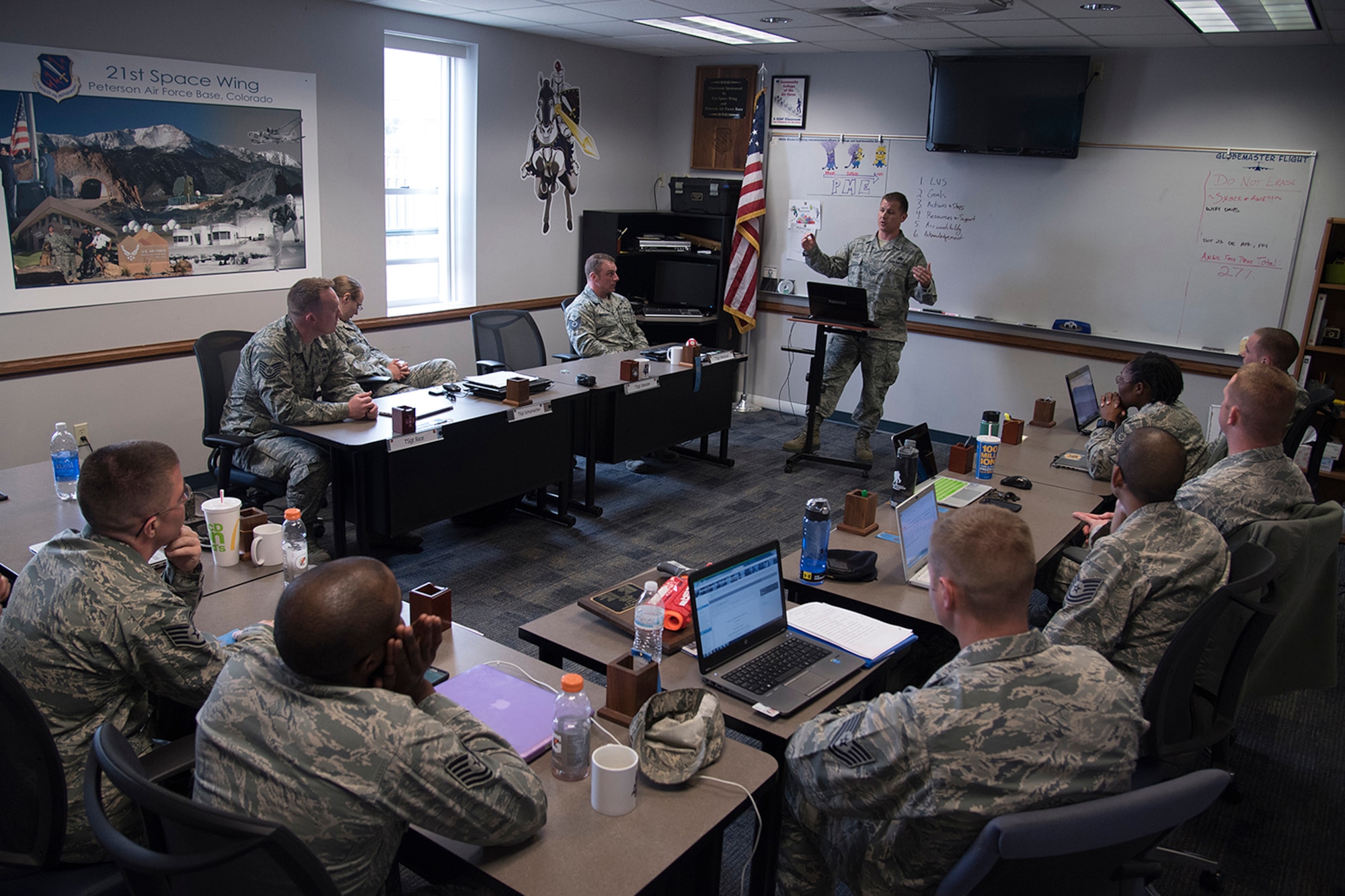 PETERSON AIR FORCE BASE, Colo. – Forrest L. Vosler Noncommissioned Officer Academy students conduct their outgoing presentations before their graduation at Peterson Air Force Base, Colo., April 11, 2016. The 96 technical sergeants came from 14 different bases and nine Major Commands to continue their leadership and management training following their completion of Course 15. (U.S. Air Force photo by Staff Sgt. Tiffany DeNault)