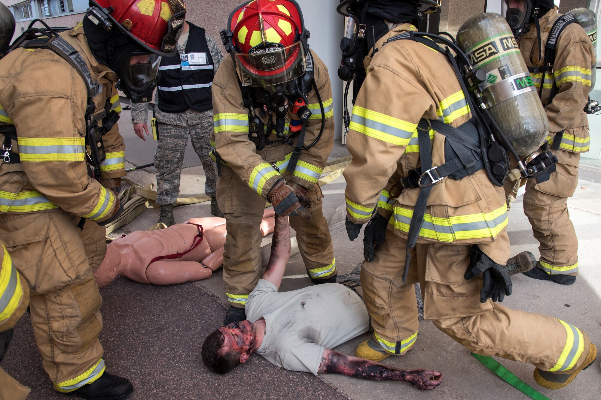 PETERSON AIR FORCE BASE, Colo. – Peterson firefighters respond to a simulated building explosion and resulting fire Feb. 18, 2016. The 21st Civil Engineer Squadron Emergency Management Flight is hosting a PrepareAthon April 29 to highlight the importance of emergency preparation. (U.S. Air Force photo by Craig Denton)