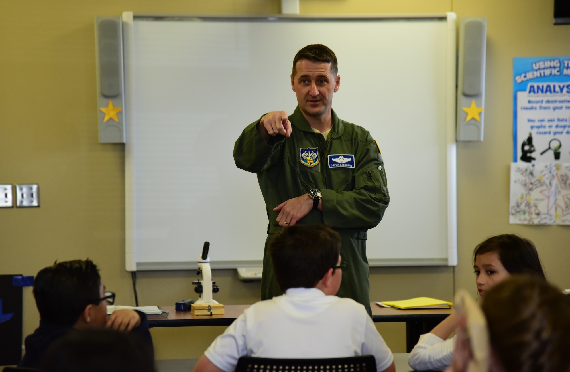 PETERSON AIR FORCE BASE, Colo. - Brig. Gen. Steven Nordhaus, NORAD Deputy Director of Operations, answers questions about aircraft dynamics from students of Starbase Academy at Peterson Air Force Base, Apr. 8, 2016. Starbase Academy focuses on teaching students advanced science, technology, engineering and mathematics. (U.S. Air Force photo by Staff Sgt. Amber Grimm)