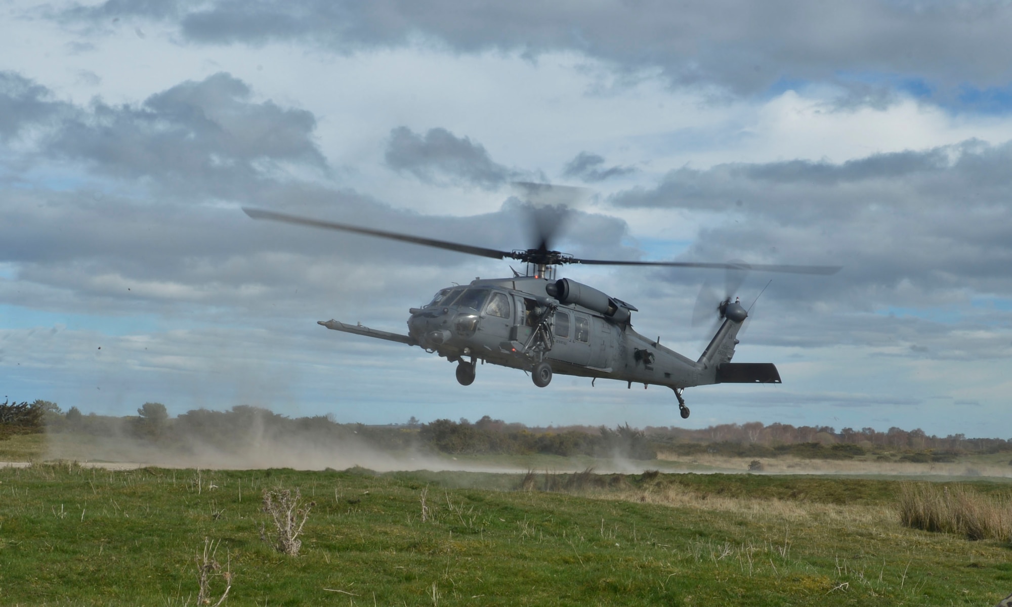 An HH-60G Pave Hawk takes-off after a simulated combat search and rescue exercise during Joint Warrior 2016 at Royal Air Force Tain, Scotland, April 20. The training for the 56th Rescue Squadron will not only provide insight from its coalition counter parts, but will prepare the squadron for future taskings downrange. (U.S. Air Force photo/Senior Airman Nigel Sandridge)
