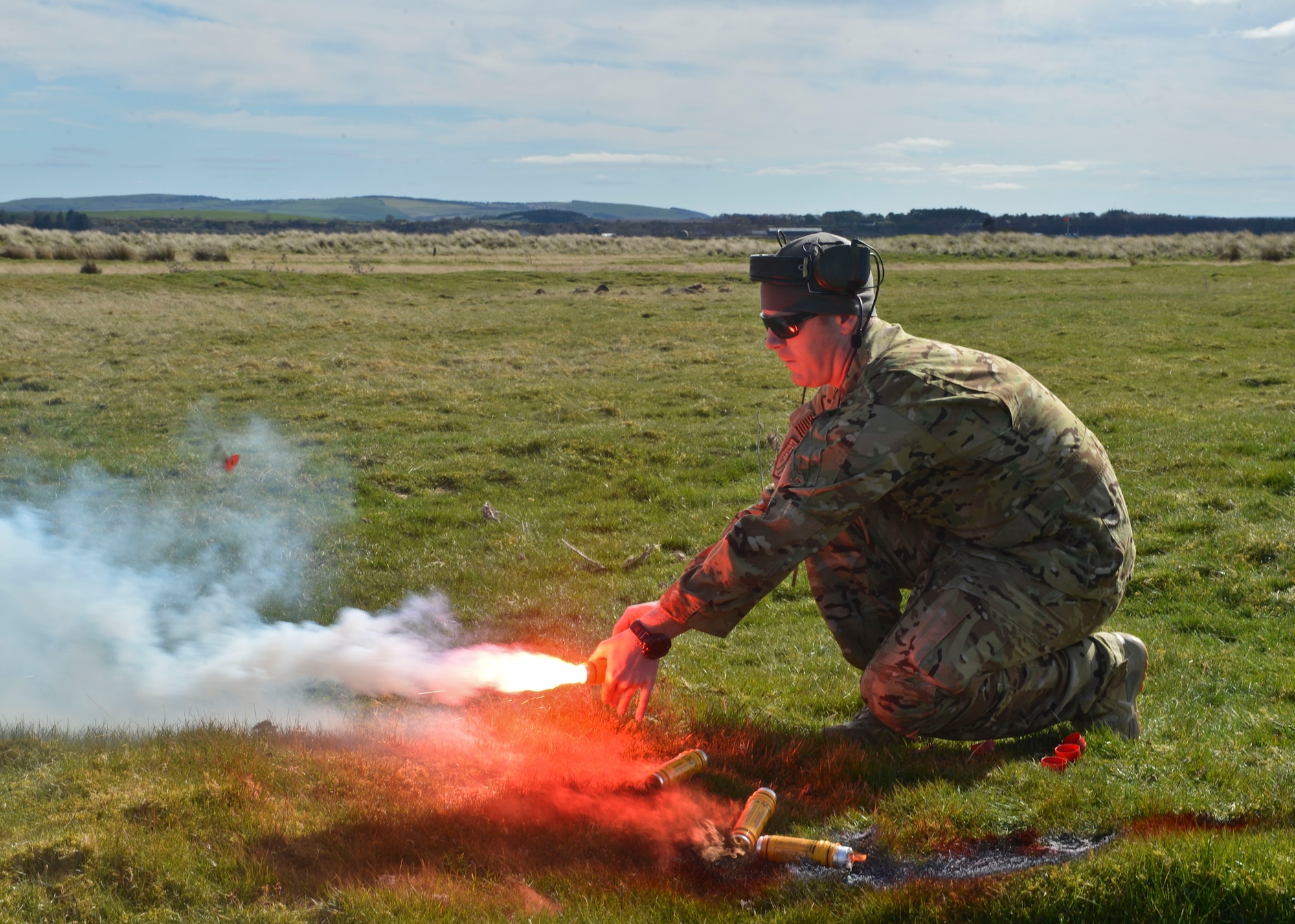 Capt. Michael Bush, 56th Rescue Squadron director of staff, sets-off emergency flares during Joint Warrior 2016 at Royal Air Force Tain, Scotland, April 20. Flares are used for signaling, illumination or defensive counter measures during rescue missions. (U.S. Air Force photo/Senior Airman Nigel Sandridge)