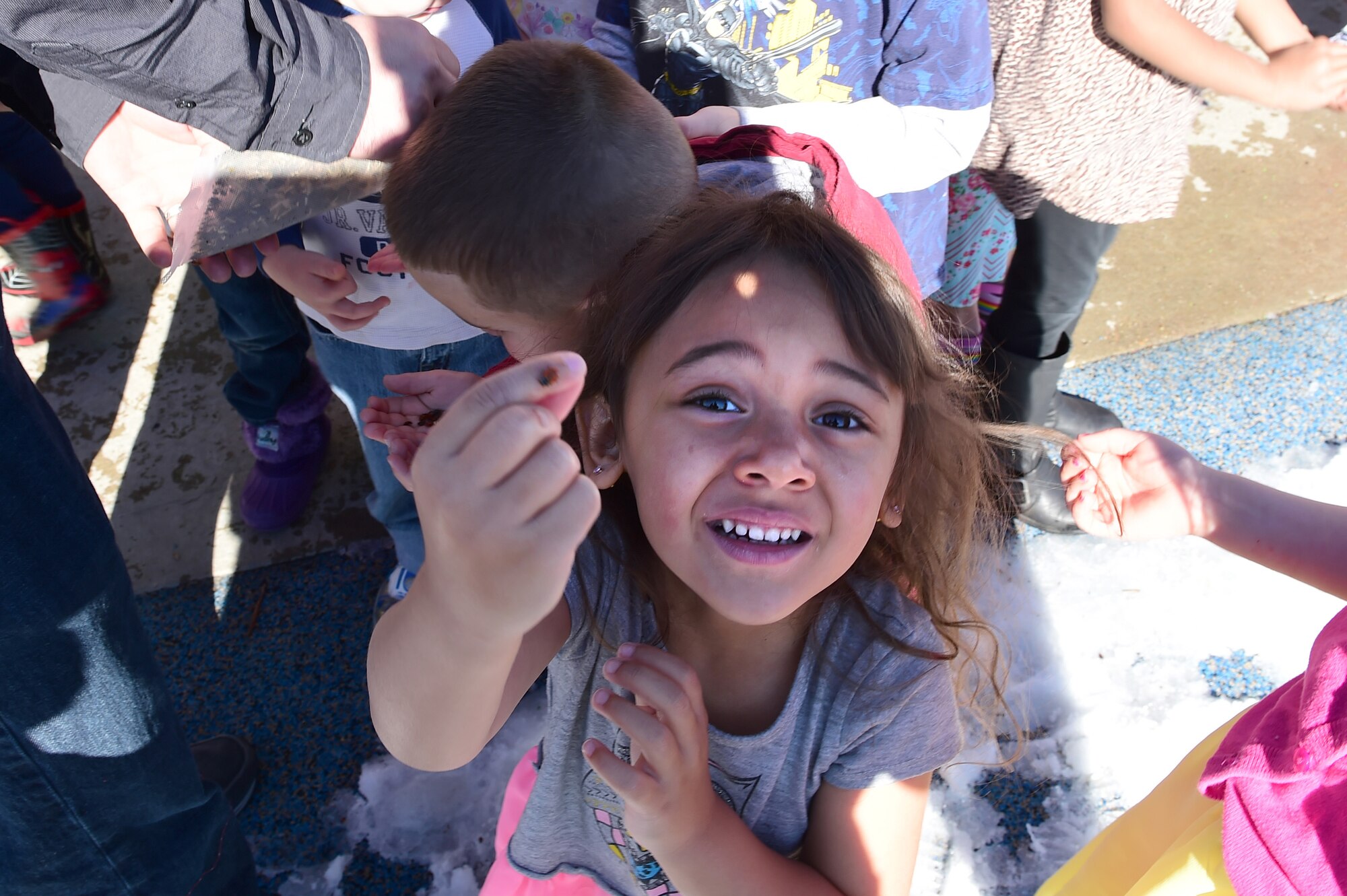 Children from the Crested Butte Child Development Center release ladybugs April 22, 2016, on Buckley Air Force Base, Colo. The release of the ladybugs is in honor of Earth Day. Ladybugs feed on harmful landscape pests which can destroy plants. (U.S. Air Force photo by Airman 1st Class Luke W. Nowakowski/Released)