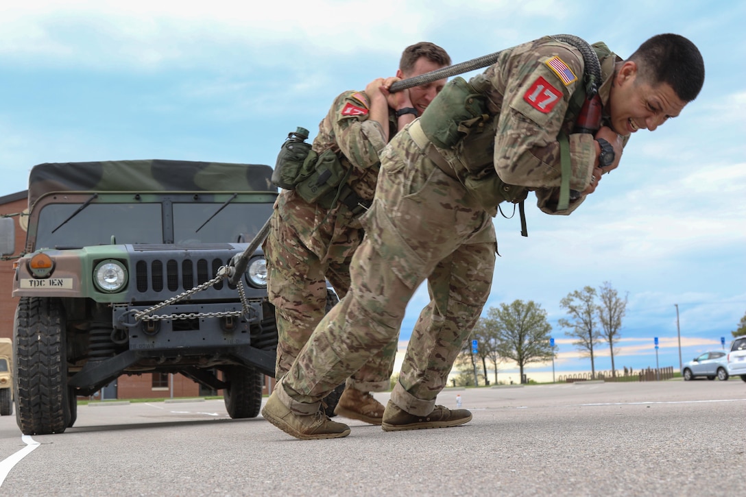 Army 1st Sgt. Jose Casillas and Sgt. 1st Class Tim Shay haul a tactical vehicle during the Best Sapper Competition at Fort Leonard Wood, Mo., April 21, 2016. Casillas and Shay are paratroopers assigned to the 82nd Airborne Division’s 307th Brigade Engineer Battalion, 3rd Brigade Combat Team. Army photo by Sgt. Anthony Hewitt