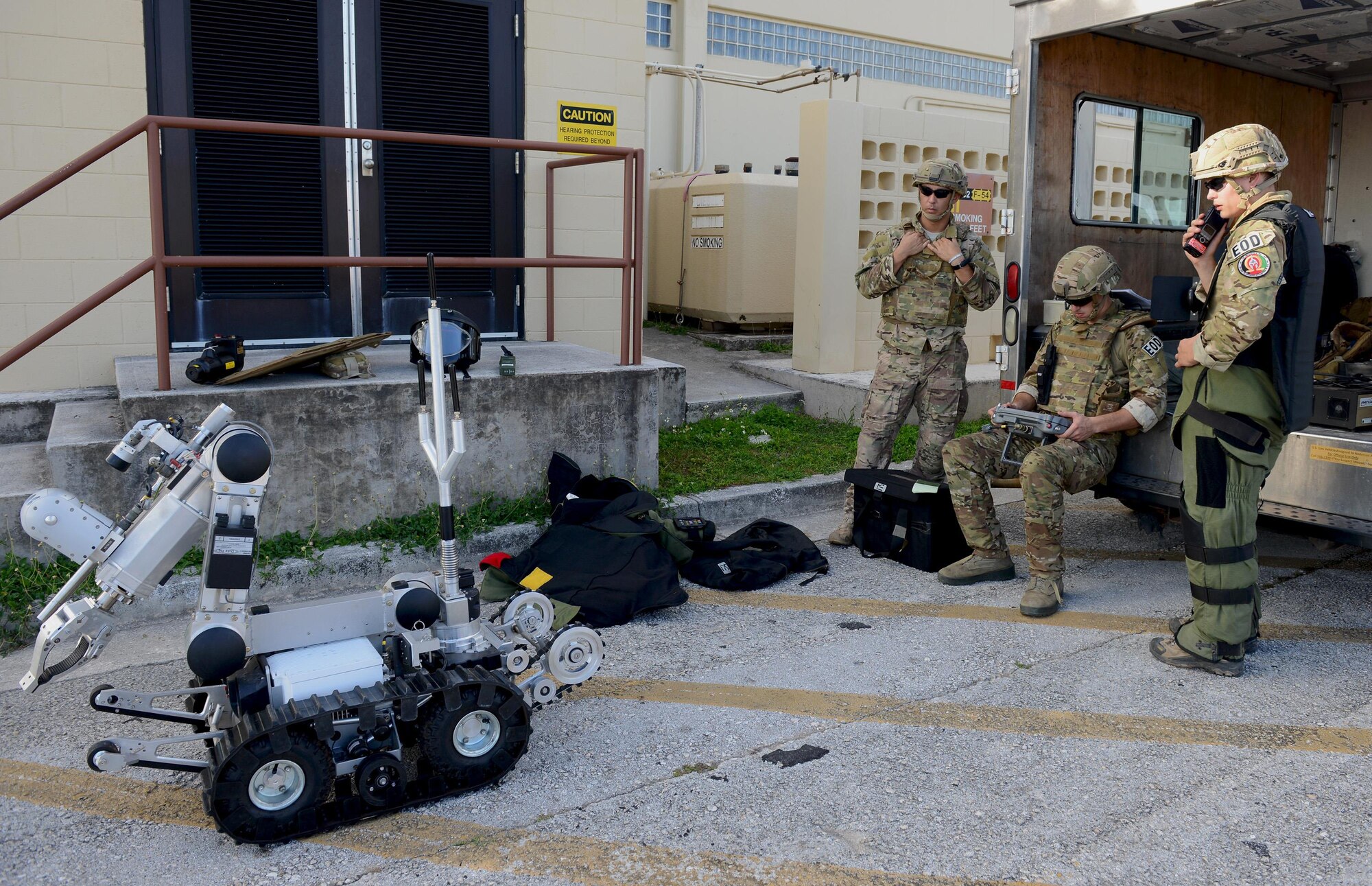 Airmen with the 36th Civil Engineer Squadron Explosive Ordnance Disposal operate an EOD robot during an operational readiness exercise April 19, 2016, at Andersen Air Force Base, Guam. The robot is often used to detect explosives before EOD technicians attempt to diffuse or remove such devices. (U.S. Air Force photo by Airman 1st Class Arielle Vasquez/Released)