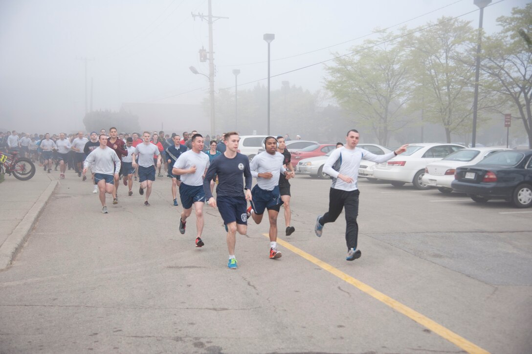 Team Osan Airmen begin racing at the Sexual Assault Awareness Prevention Month 5K run at Osan Air Base, Republic of Korea, April 15, 2016. The 5K run was one of Osan’s Sexual Assault Awareness Prevention Month events to raise awareness on prevention of sexual assaults. (U.S. Air Force photo by Staff Sgt. Jonathan Steffen/Released)