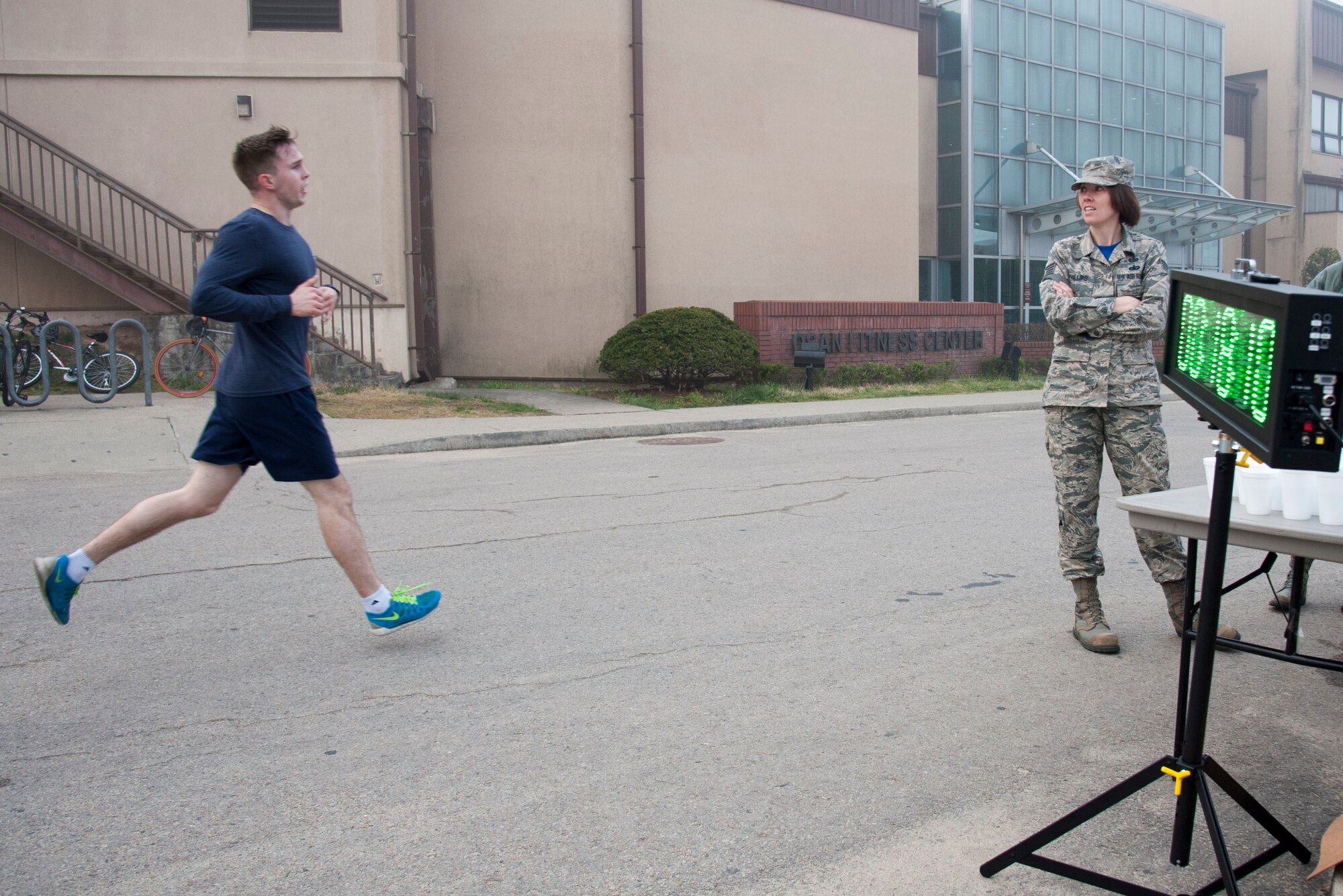 Airman 1st Class Jefferson Klapak, 51st Civil Engineer Squadron firefighter, takes first place during a Sexual Assault Awareness Prevention Month 5K run at Osan Air Base, Republic of Korea, April 15, 2016. The 5K run was one of Osan’s Sexual Assault Awareness Prevention Month events to raise awareness on prevention of sexual assaults. (U.S. Air Force photo by Staff Sgt. Jonathan Steffen/Released)