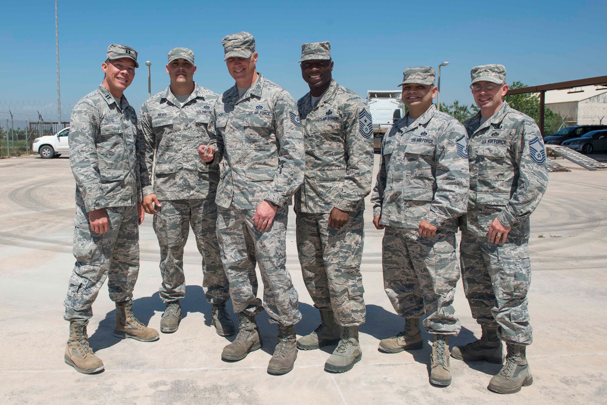 U.S. Air Force Chief Master Sgt. Vegas Clark, 39th Air Base Wing command chief, stands with 39th Civil Engineer Squadron Airmen, April 25, 2016, at Incirlik Air Base, Turkey. Clark met with the 39th CES quality assurance flight to view and learn more about the tasks they accomplish. (U.S. Air Force photo by Senior Airman John Nieves Camacho/Released)