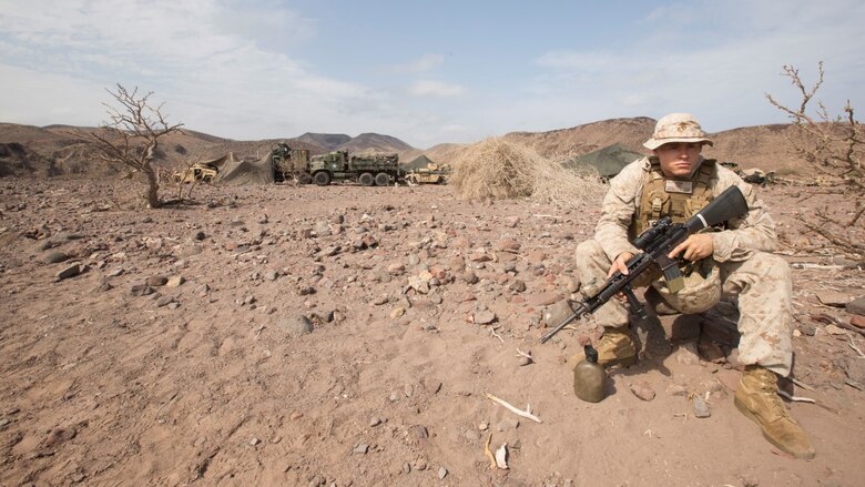 Cpl. Corey Osborne, a cannoneer with the 13th Marine Expeditionary Unit, stands security Djibouti, Apr. 9, 2016. Osborne acts as a look out as Marines and sailors from Combat Logistics Battalion 13, the logistics combat element for the 13th MEU, fortify the encampment being built. The 13th MEU is conducting sustainment training to maintain proficiency and combat readiness while deployed with the Boxer Amphibious Ready Group during Western Pacific Deployment 16-1. 