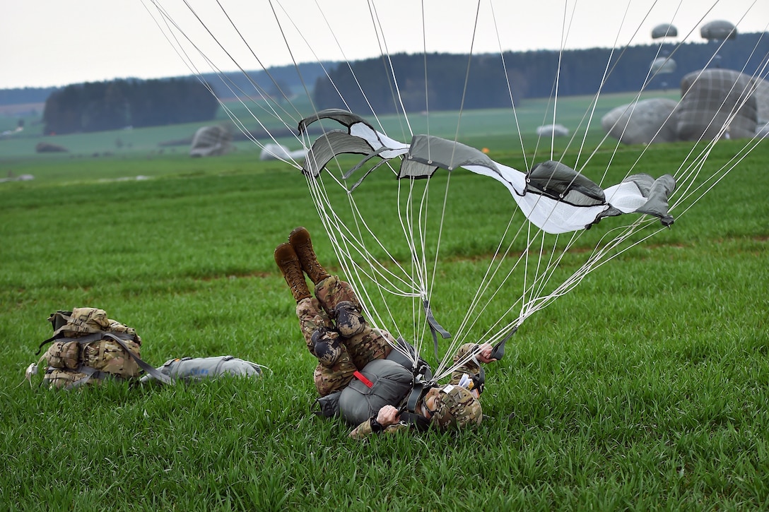 A U.S. paratrooper conducts a parachute landing fall during airborne operations as part of exercise Saber Junction 16 near Hohenfels, Germany, April 12, 2016. Army photo by Gertrud Zach