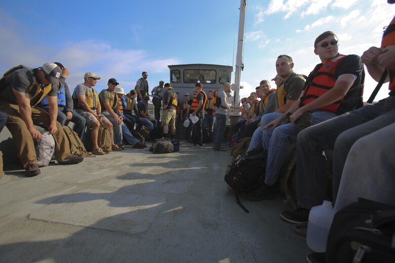 Marines from 2nd Radio Battalion and 2nd Law Enforcement Battalion take a ferry to Shackleford Banks Island to clean up trash and debris on the island’s beach on April 21, 2016. The day was organized by both the Single Marine program and the National Park Service with the help of Gunnery Sgt. Bernard Snyder, the Communications chief for 2nd LEB. (U.S. Marine Corps photo by Lance Cpl. Miranda Faughn/Released)