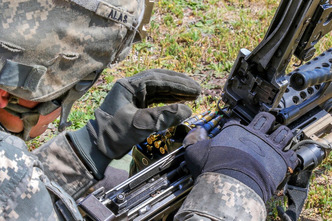 Army Pvt. Steven Alas loads his M249 light machine gun during a live-fire exercise at Fort Bragg, N.C., April 13, 2016. Alas is assigned to the 82nd Airborne Division’s 2nd Battalion, 325th Airborne Infantry Regiment, 2nd Brigade Combat Team. Army photo by Staff Sgt. Jason Hull