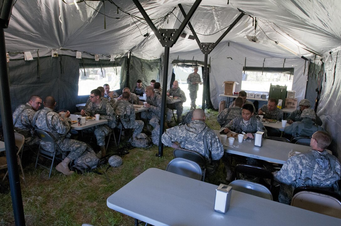 Soldiers with the 733rd Transportation Company, based out of Reading, Pa., eat the meal prepared by the food service specialists of the 733rd T.C. during the annual Philip A. Connelly Award competition at Fort Indiantown Gap, Pa., April 23, 2016. (U.S. Army photo by Staff Sgt. Dalton Smith / Released)