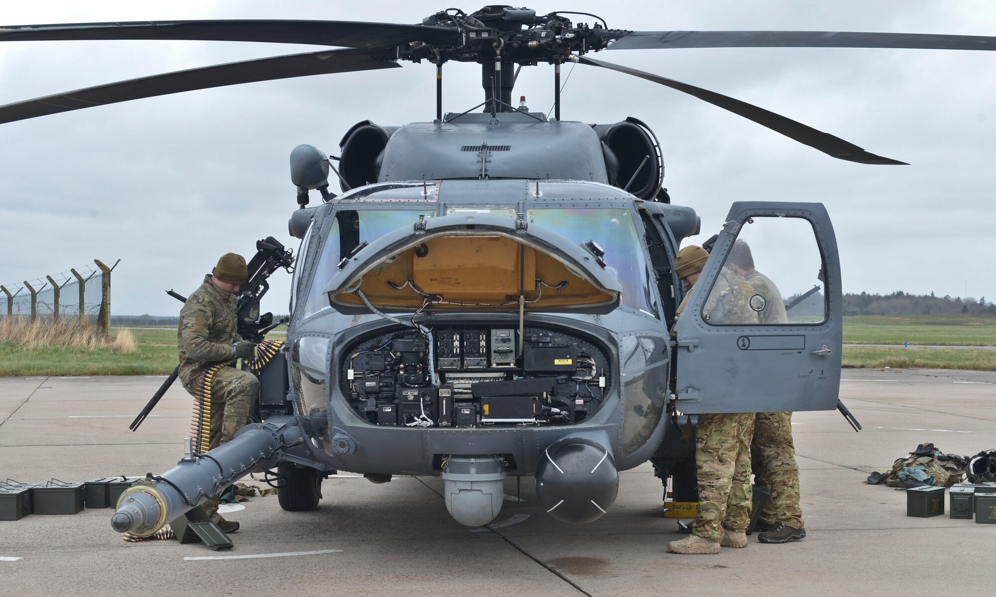 Crew members perform a preflight inspection on a 56th Rescue Squadron HH-60G Pave Hawk during Joint Warrior 2016 at Royal Air Force Lossiemouth, Scotland, April 15, 2016. Joint Warrior is a three-week multination event catered to enhancing the capabilities of its personnel for real-world events through various forms of training, including air-to-ground combat. (U.S. Air Force photo/Senior Airman Nigel Sandridge)
