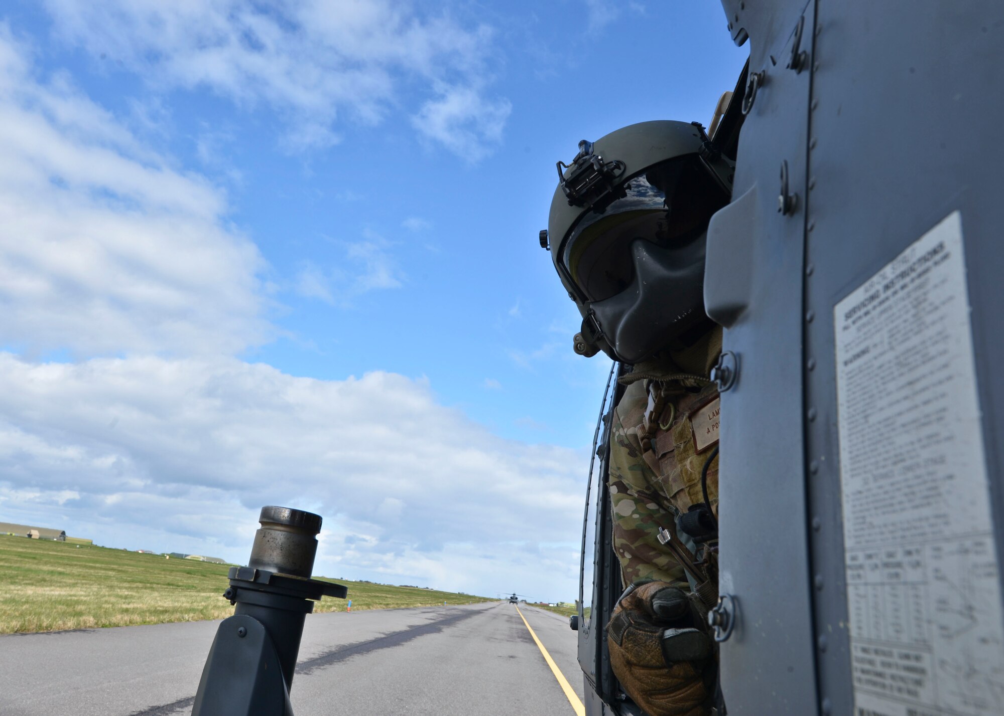 Staff Sgt. William Lambert, a 56th Rescue Squadron special mission aviator instructor, inspects the tail of an HH-60G Pave Hawk during Joint Warrior 2016 at Royal Air Force Lossiemouth, Scotland, April 15, 2016. The training provided the 56th RQS with the opportunity to work hand in hand with other rescue forces from the U.S. and their foreign equivalents. (U.S. Air Force photo/Senior Airman Nigel Sandridge)