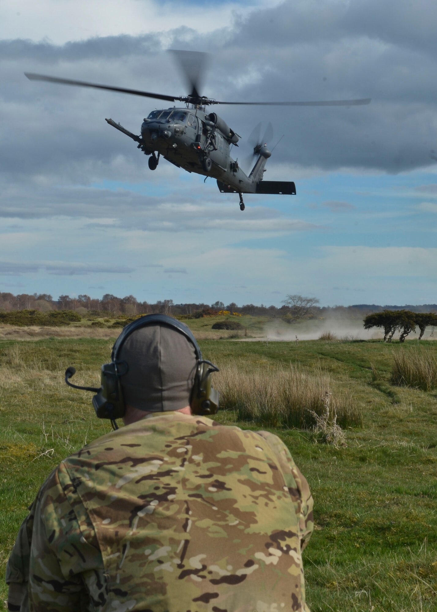 An HH-60G Pave Hawk performs a tactical landing during Joint Warrior 2016 at Royal Air Force Tain, Scotland, April 20, 2016. The exercise provided three weeks of air, ground, and naval training exercises to NATO participants which improve real-world capabilities. (U.S. Air Force photo/Senior Airman Nigel Sandridge)