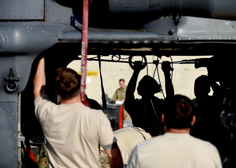 The 455th Expeditionary Aircraft Maintenance Squadron conducts a pre-flight inspection on a HH-60G Pave Hawk before takeoff at Bagram Airfield, Afghanistan, April 25, 2016. The HH-60G is the main aircraft used for Air Force search and rescue teams but also carries out civil search and rescue, medical evactuation, disaster response, and humanitarian assistance. (U.S. Air Force photo by Senior Airman Justyn M. Freeman)
