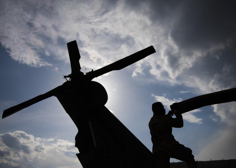 Senior Airman Carlos Thompson, 455th Expeditionary Aircraft Maintenance Squadron crew chief, conducts a pre-flight check of a HH-60G Pave Hawk before takeoff at Bagram Airfield, Afghanistan, April 25, 2016. Members of the 455th Expeditionary Aircraft Maintenance Squadron ensure that aircraft at Bagram are prepared for flight and return them to a mission-ready state once they land. (U.S. Air Force photo by Senior Airman Justyn M. Freeman)