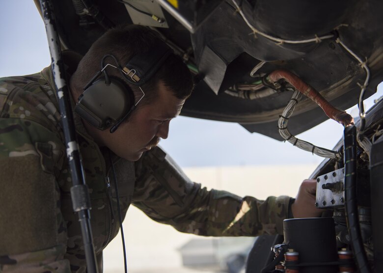 Staff Sgt. Ryan Wilkerson, 455th Expeditionary Aircraft Maintenance Squadron guidance and control journeyman, conducts a pre-flight inspection for a HH-60G Pave Hawk before takeoff at Bagram Airfield, Afghanistan, April 25, 2016. Members of the 455th Expeditionary Aircraft Maintenance Squadron ensure that aircraft at Bagram are prepared for flight and return them to a mission-ready state once they land. (U.S. Air Force photo by Senior Airman Justyn M. Freeman)