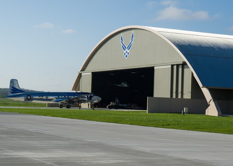 DAYTON, Ohio -- The Douglas VC-118 “Independence” being towed into the fourth building at the National Museum of the United States Air Force on April 23, 2016. This aircraft is one of ten Presidential aircraft in the collection. (U.S. Air Force photo by Ken LaRock) 