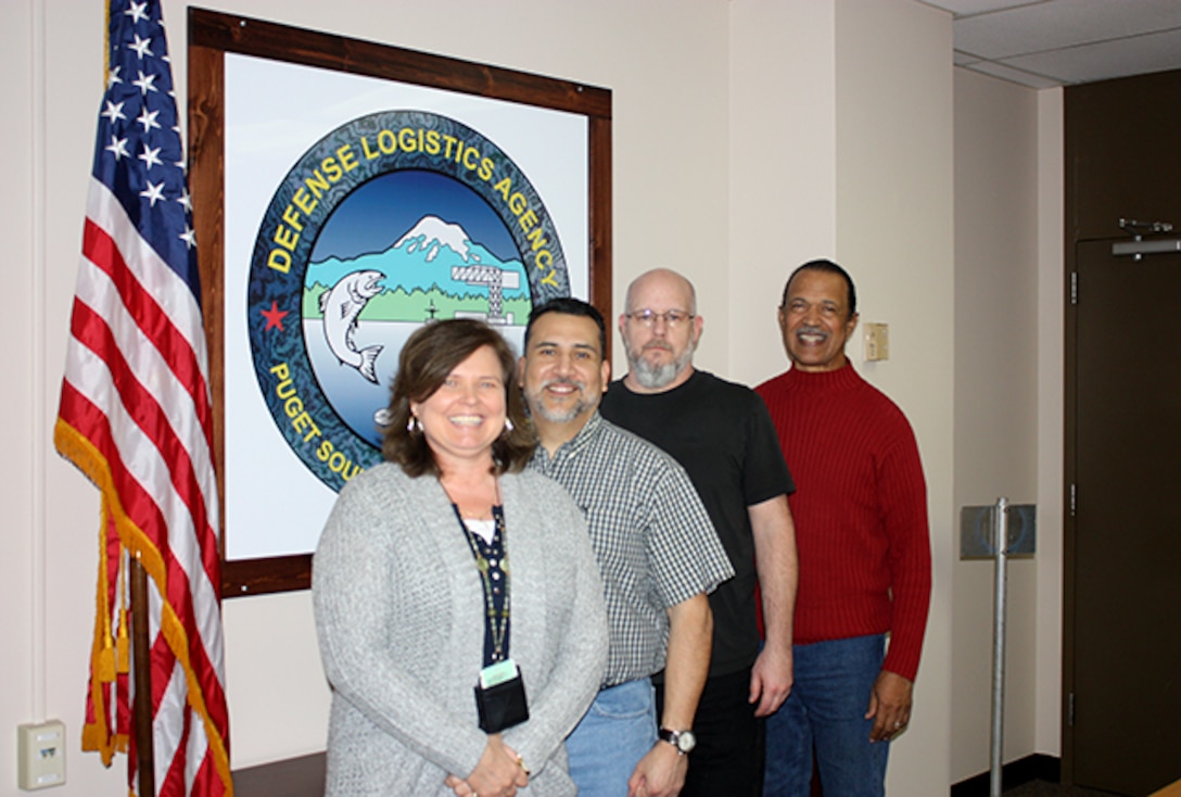 The DELTA Trident Project Material Support Team (l-r) Lisa Benning, Raul Davila, John Slocum, Benny Myers, all part of DLA Maritime Puget Sound. Their hard work ensures timely material is provided to maintain Ohio-class submarines while in-port for maintenance. 