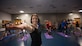 Lt. Col. Janelle Macaulay, the 305th Operations Support Squadron commander, leads members of her unit in a yoga class April 19, 2016, at the Falcon Fitness Center at Joint Base McGuire-Dix-Lakehurst, N.J. Yoga is one of several mental and physical fitness initiatives Macaulay and her leadership have implemented in the squadron. (U.S. Air Force photo/Staff Sgt. Katherine Tereyama)