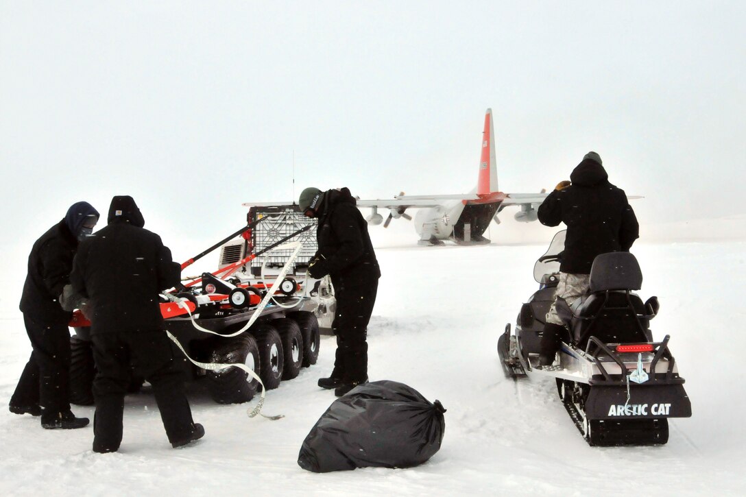 Air Force airmen prepare ski-way grooming equipment to be loaded onto an LC-130 Hercules aircraft at Little Cornwallis Island, Nunavut, Canada, April 13, 2016, in support of Canada's annual Operation Nunalivut. Air National Guard photo by Airman 1st Class Jamie Spaulding