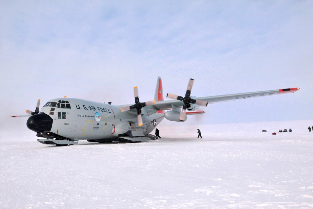 Air Force airmen prepare an LC-130 Hercules aircraft as it sits on the newly constructed ski-way at Little Cornwallis Island, Nunavut, Canada, April 13, 2016, in support of Canada's annual Operation Nunalivut. Air National Guard photo by Airman 1st Class Jamie Spaulding