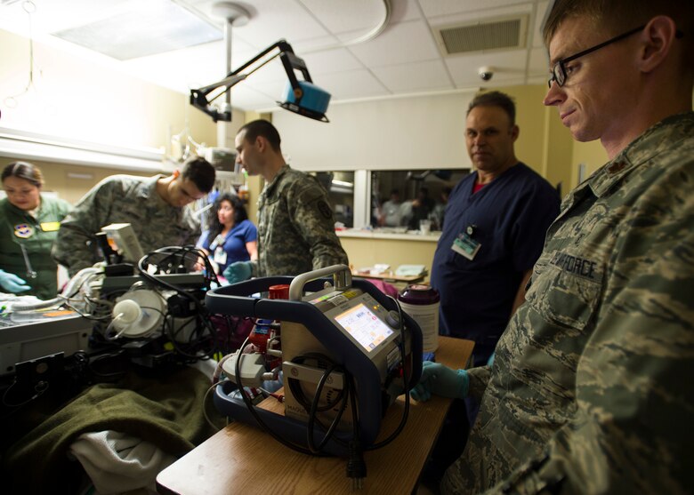 Maj. James Lantry (right), Extracorporeal Membrane Oxygenation transport team vice director, watches for stabilization on the ECMO system prior to transporting the patient to San Antonio Military Medical Center, Joint Base San Antonio-Fort Sam Houston, Texas, April 20. Prior to a patient being transferred to a new location, a patient’s vital must be stable for four hours. (U.S. Air Force photo/Staff Sgt. Kevin Iinuma)