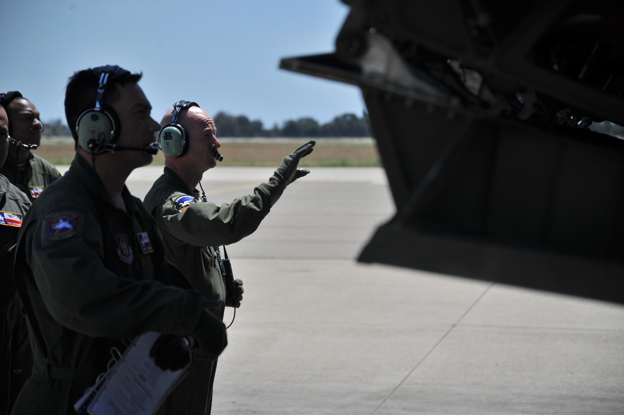 U.S. Air Force Airmen assigned to the 433rd Airlift Wing, Joint Base San Antonio-Lackland, Texas, watch as the rear ramp of a C-5M Super Galaxy is lowered during the Patriot Hook exercise at Joint Forces Training Base, Los Alamitos, California, April 22, 2016. Patriot Hook is a multi-service exercise coordinated by the Air Force Reserve, designed to integrate military, federal, state and local agencies, and provide training in quickly mobilizing and deploying first responders in the event of a regional emergency or natural disaster. (U.S. Air Force photo by Senior Airman Steven A. Ortiz/Released) 