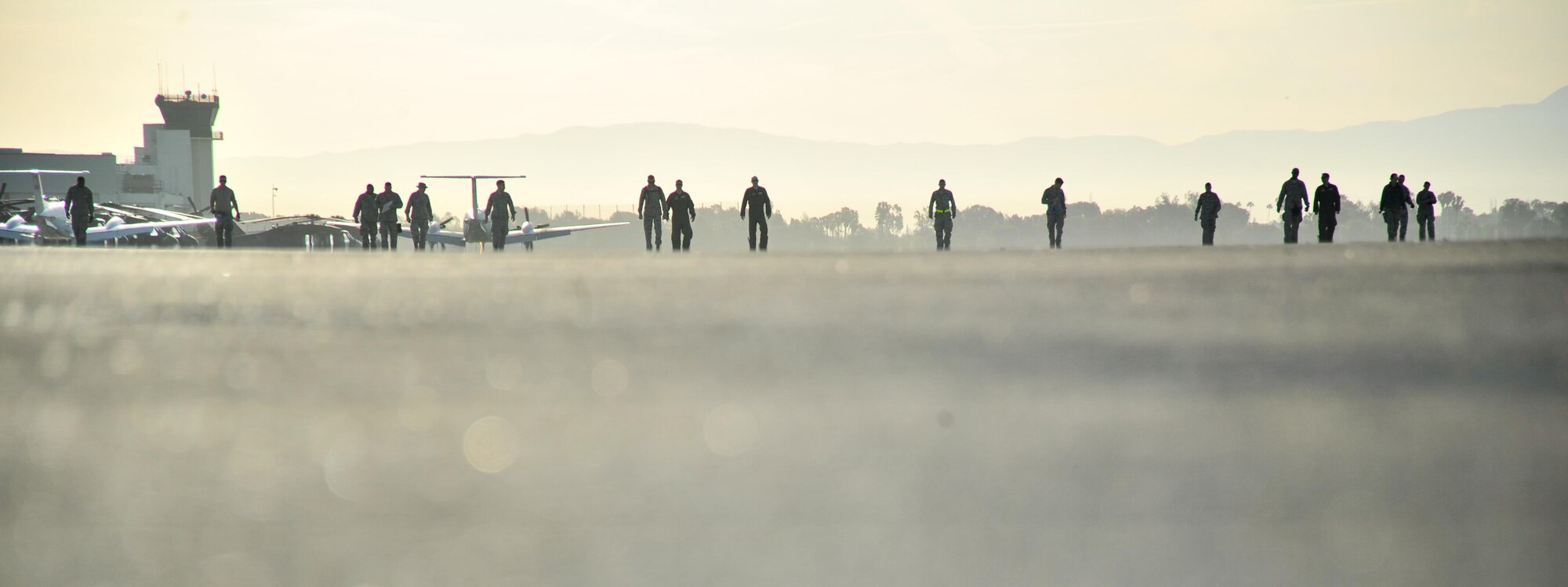 U.S. Air Force Airmen assigned to the 433rd Airlift Control Flight, Joint Base San Antonio-Lackland, Texas, sweep the flight line for Foreign Object Debris during the Patriot Hook exercise at Joint Forces Training Base, Los Alamitos, California, April 21, 2016. Patriot Hook is a multi-service exercise coordinated by the Air Force Reserve, designed to integrate military, federal, state and local agencies, and provide training in quickly mobilizing and deploying first responders in the event of a regional emergency or natural disaster. (U.S. Air Force photo by Senior Airman Steven A. Ortiz/Released) 