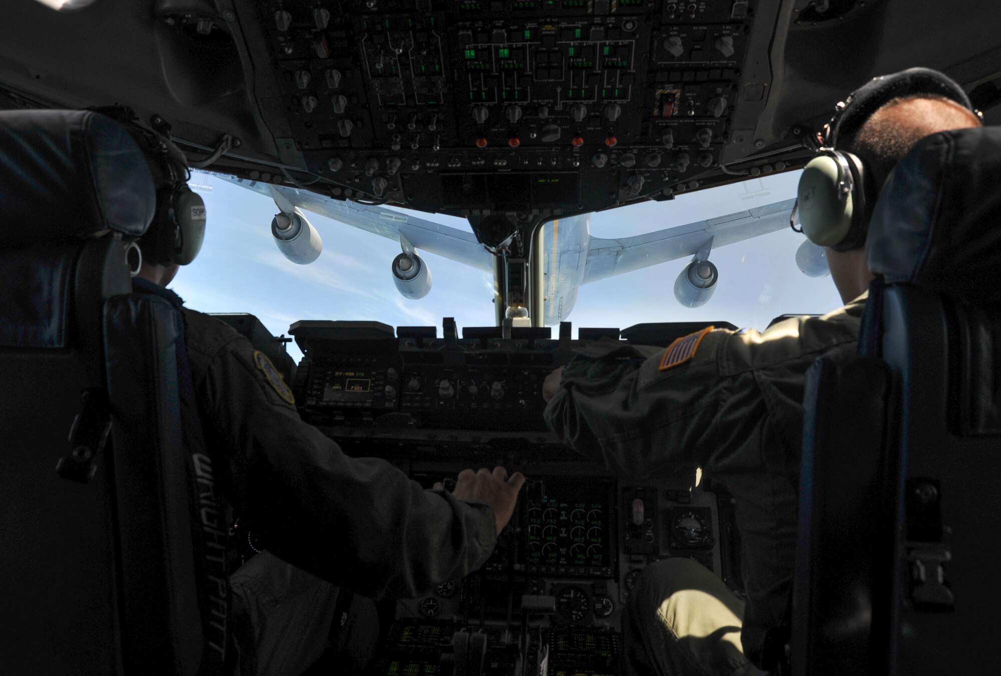 (Left) Capt. John Moore and Col. David Ackerson from the 452nd Air Mobility Wing, March Air Reserve Base, California, perform an in-flight refueling in a C-17 Globemaster III aircraft over California, during Patriot Hook, April 21, 2016. Patriot Hook is a multi-service exercise coordinated by the Air Force Reserve, designed to integrate military, federal, state and local agencies, and provide training in quickly mobilizing and deploying first responders in the event of a regional emergency or natural disaster. (U.S. Air Force photo by Senior Airman Steven A. Ortiz/Released) 