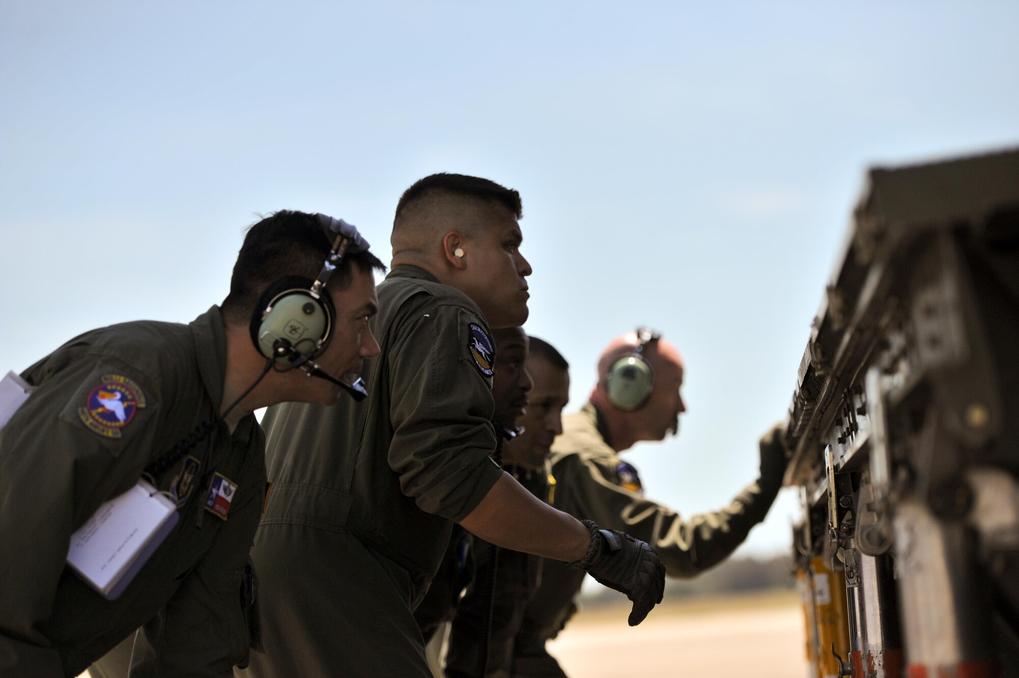 U.S. Air Force Airmen assigned to the 356th Airlift Squadron, Joint Base San Antonio-Lackland, Texas, watch as the rear ramp of a C-5M Super Galaxy is lowered during Patriot Hook, Los Alamitos Army Airfield, California, April 20, 2016. Patriot Hook is a multi-service exercise coordinated by the Air Force Reserve, designed to integrate military, federal, state and local agencies, and provide training in quickly mobilizing and deploying first responders in the event of a regional emergency or natural disaster. (U.S. Air Force photo by Senior Airman Steven A. Ortiz/Released)